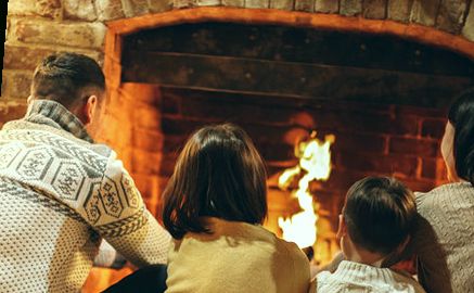 Family by the winter fire
